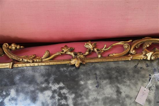 A George III Chippendale style carved and giltwood wall mirror, in the manner of Mathias Lock, W.2ft 3in. H.4ft 5in.